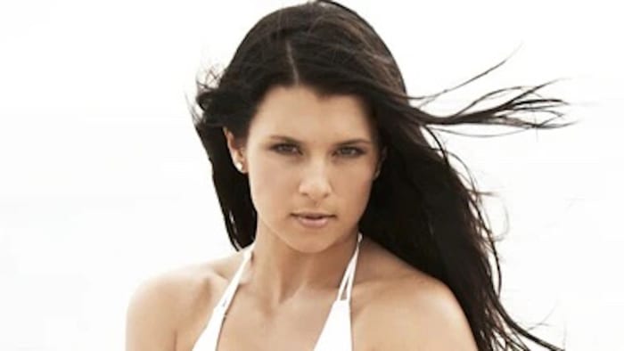 Danica Patrick poses in a white bikini.